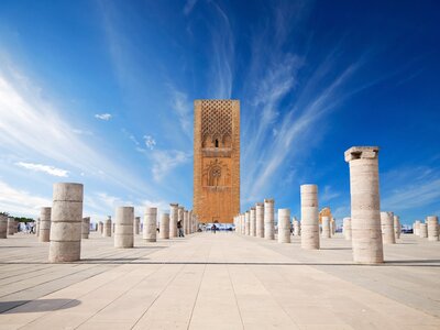 Symmetrical central pathway aligned view leading towards Hassan tower in the square with stone columns, tourist complex in Rabat, Morocco, Africa