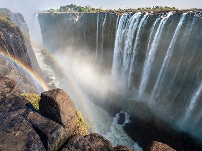 Rainbow over Victoria Falls on Zambezi River, border of Zambia and Zimbabwe, Africa