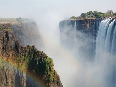 Victoria Falls Waterfall with rainbow created from water mist, Zimbabwe, Africa