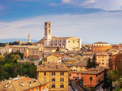 Colourful buildings on sunny day - Basilica of San Domenico in Perugia, Umbria, Italy