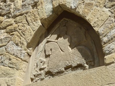 Close up of stone relief in Arezzo carved into building wall, Arezzo, Italy