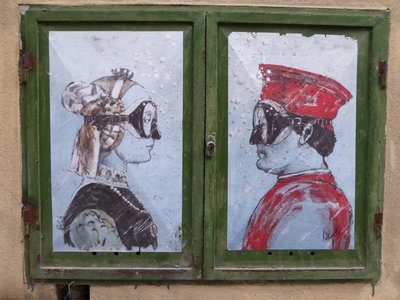 San Sepolcro street art painting rendition of Duke and Duchess of Montefeltro depicting them wearing scuba masks underwater, Italy