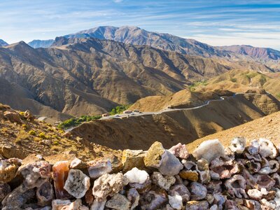 High Atlas Mountains view from Tizi n'Tichka pass with crystal rock wall in foreground, Marrakesh, Morocco