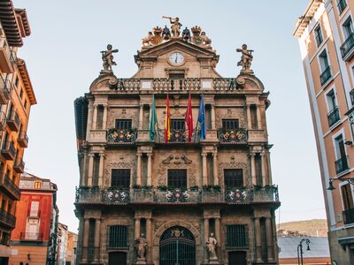 Pamplona City hall decorated with flags and statues, Spain