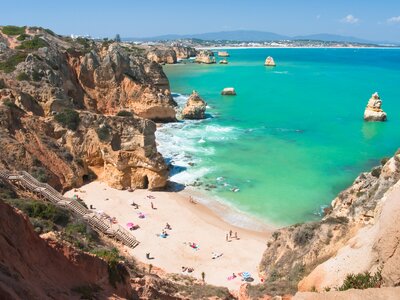 Beach on coast of Algarve with vibrant turquoise water, Algarve, Portugal