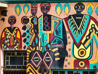 Tribal African street art mural depicting people wearing colourful clothing, Swakopmund, Namibia