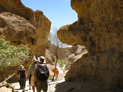 Ramble Worldwide walking group passing through rocky landscape, South Africa