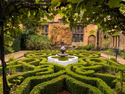 Old English Garden with knot patterned bush and Fountain at Sudeley Castle, Winchcombe, Cheltenham, Cotswolds