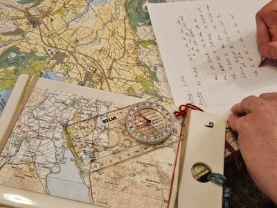 Writing down directions from map planning route - Ramble Worldwide Navigation & Hill Skills Course