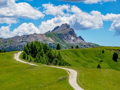 Path leading towards the imposing Dolomite mountains in Italy